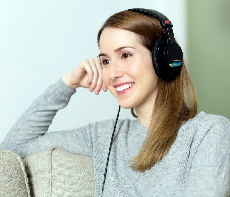 woman using earphone